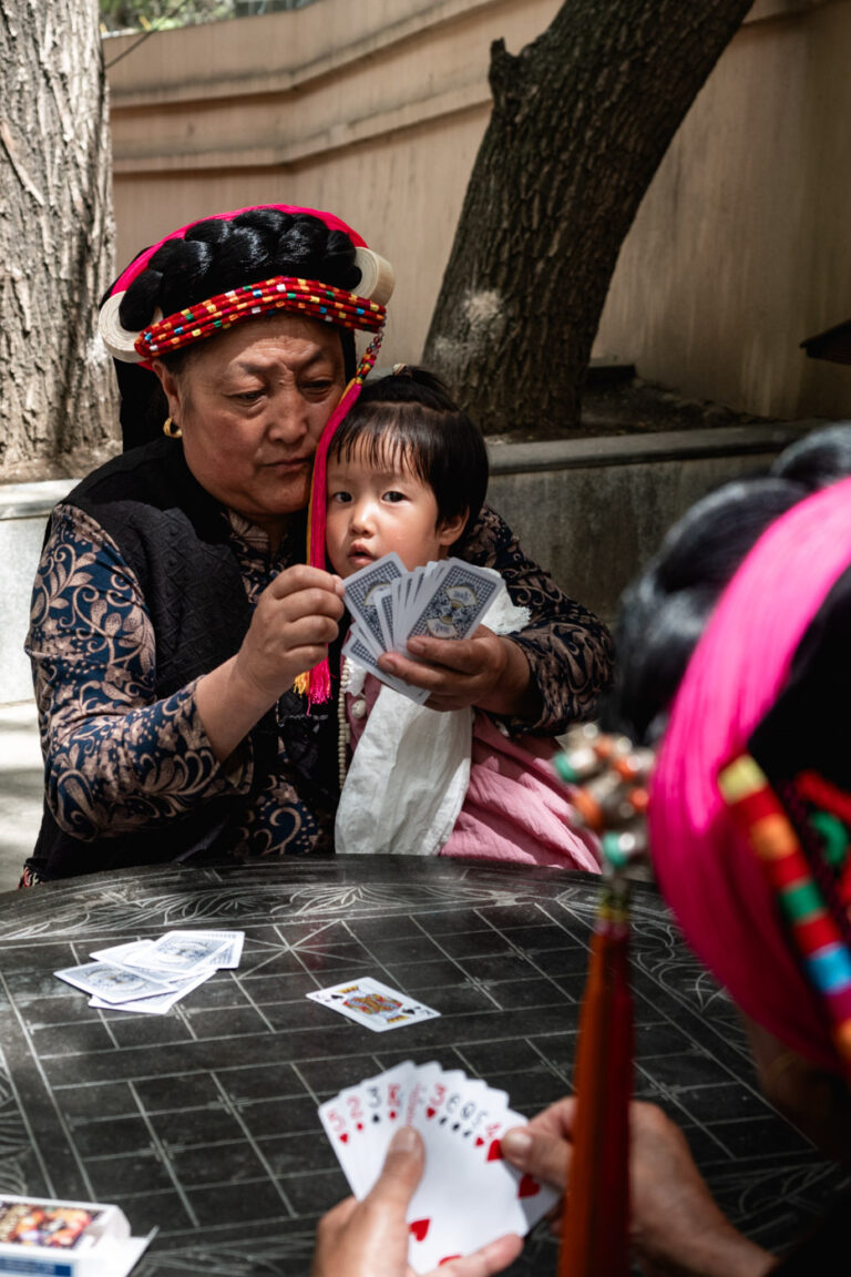 Gyarong Elderly woman with children in traditional dress, Sichuan, China.