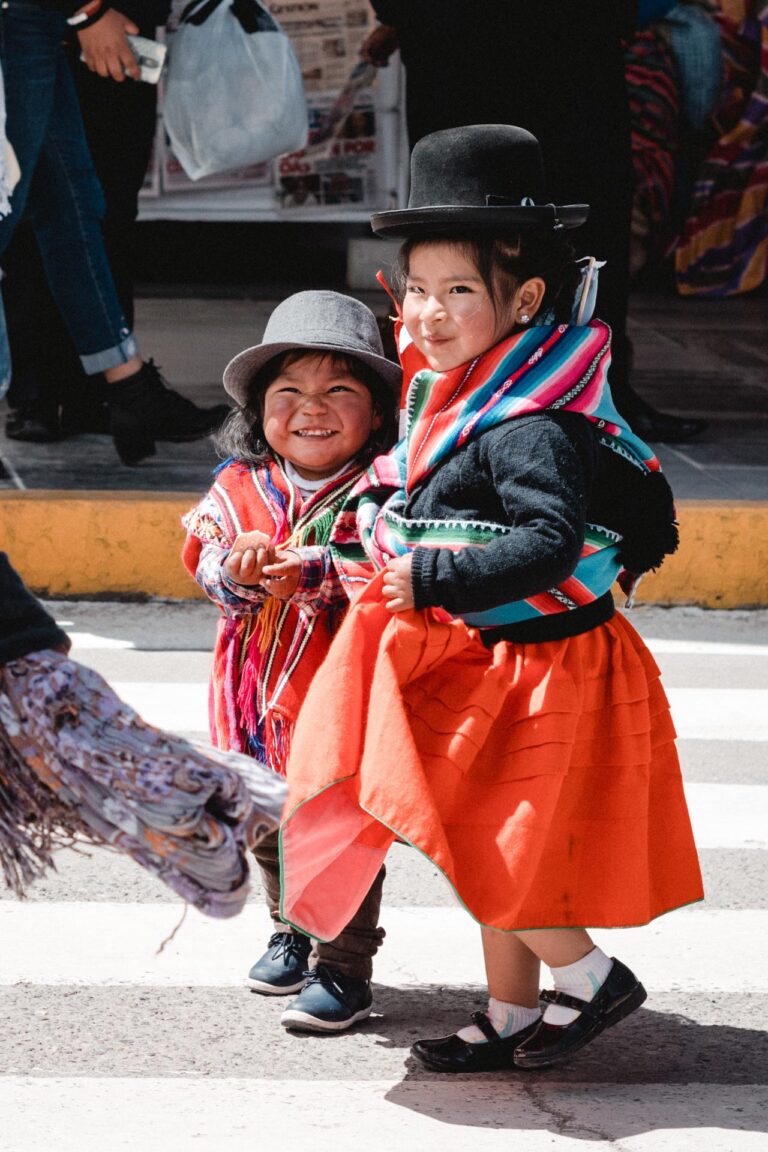 Peruvian children in a red folkloric costume, celebrating the vibrant Fiesta de la Candelaria.
