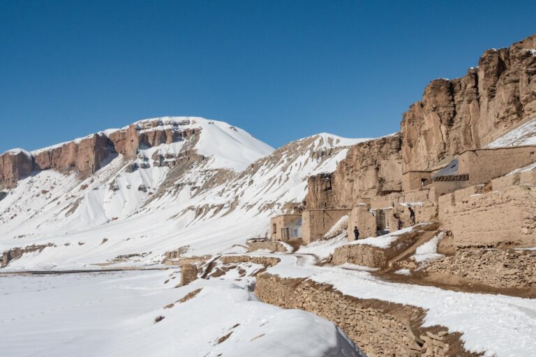 A Kharwar village, with houses made of mud bricks that blend seamlessly into the landscape, covered in snow, in the Bamyan region of Afghanistan