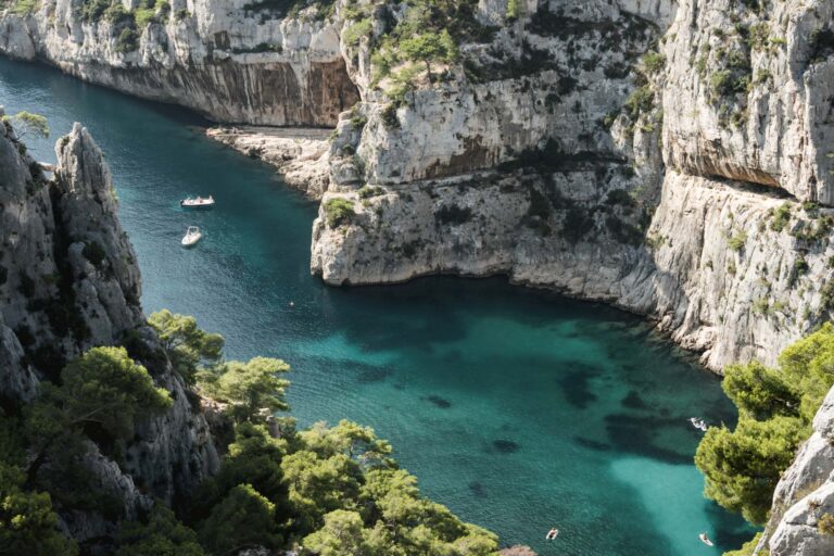 Azure waters and rugged cliffs along Calanque de Sormiou trail in Marseille, Franc