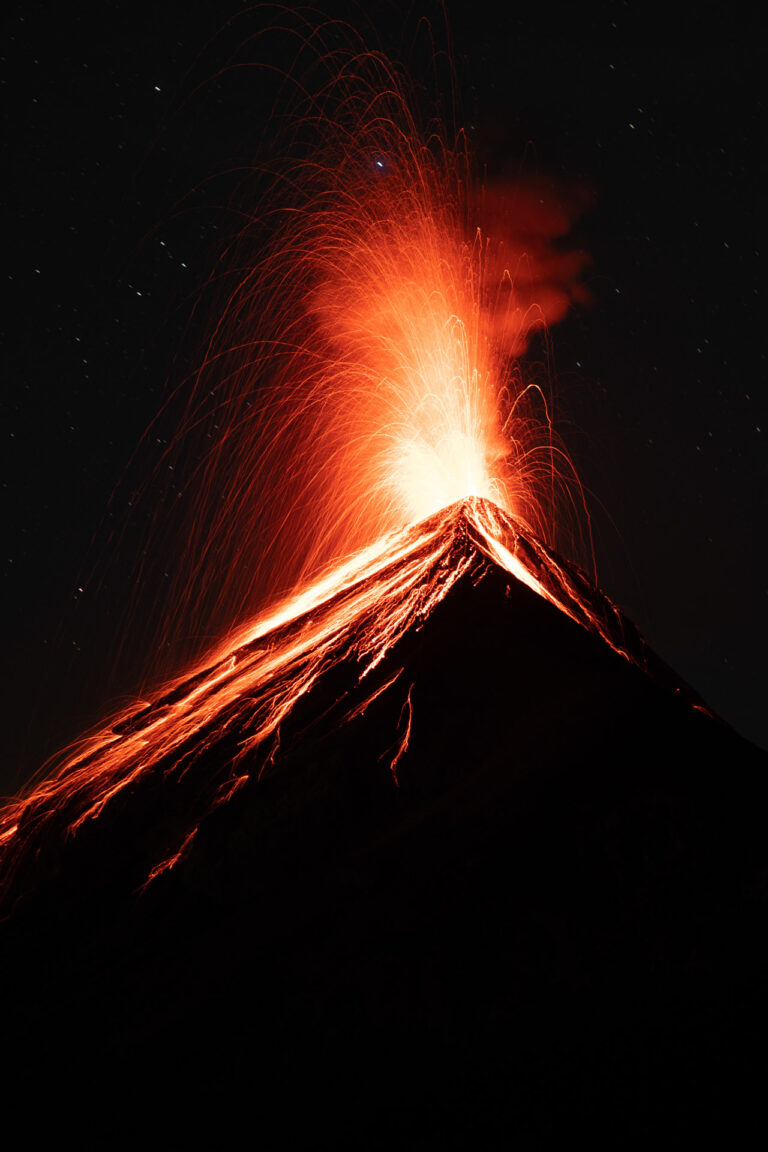 Volcanic eruption with lava glowing from Guatemala's El Fuego volcano at night