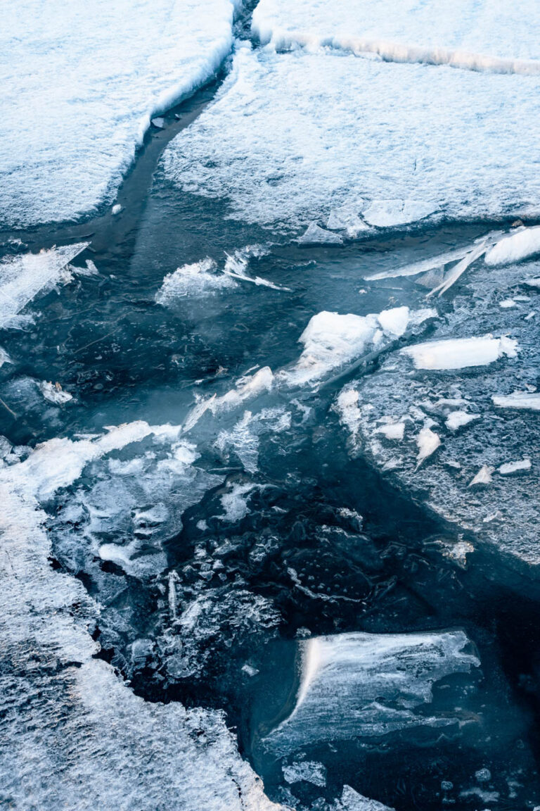 Frozen Baikal lake with blue ice slabs, Siberia