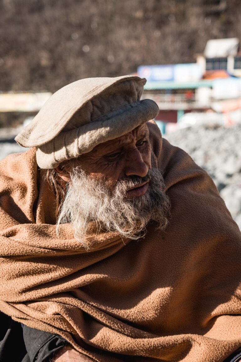 Close-up shot of a sleeping goat wrapped in a blanket inside a small barn in Madyan, Pakistan.