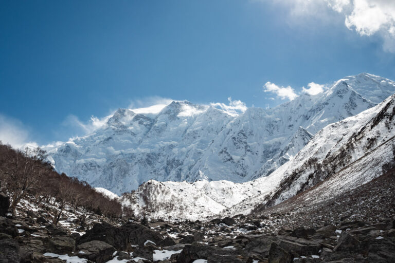 Snow-covered Nanga Parbat mountain seen from Fairy Meadows under a clear blue sky in Pakistan