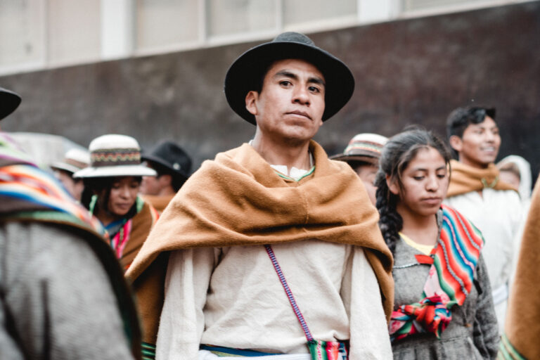 Dancer in traditional Andean costume participating in the Fiesta de la Candelaria parade in Peru.
