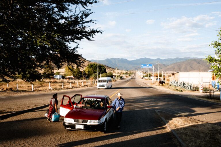 Daily life in the countryside of Mexico, a taxi standing in the middle of the street.