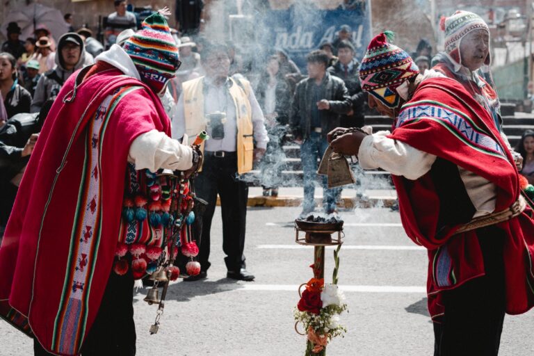 Group of vibrant Andean dancers posing together during the annual festival.