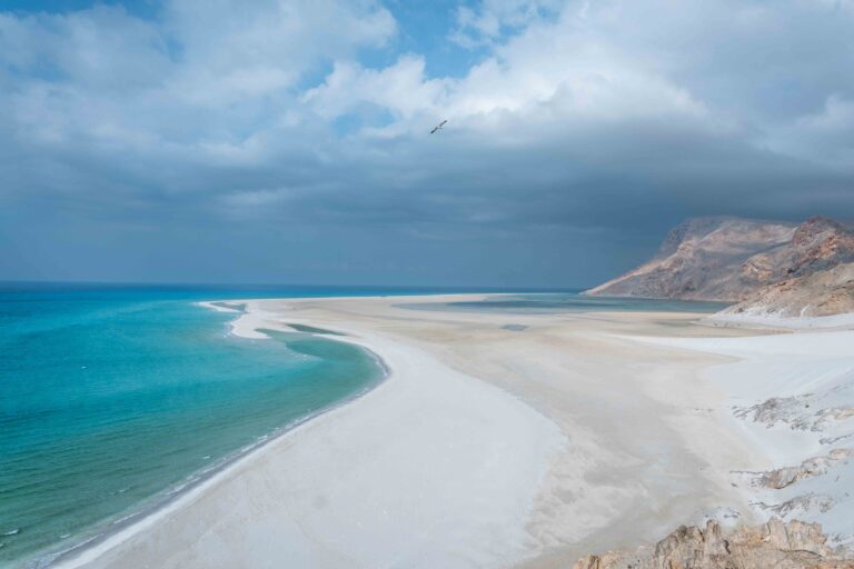 Panoramic view of the turquoise waters and white sand dunes of Detwah Lagoon.